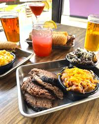 The Stellar Hog signature dishes Sliced Brisket, Pulled Pork, "The OG" Pork Steak Sandwich, Smoked Wings, Burnt Ends (when available).